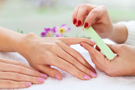 A customer receiving a nail pedicure.